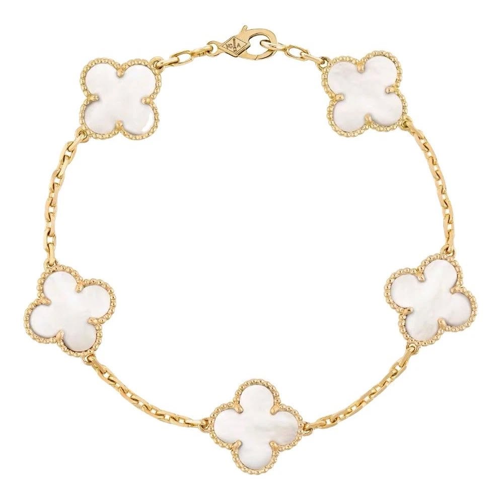 Gold bracelet with transparent clovers